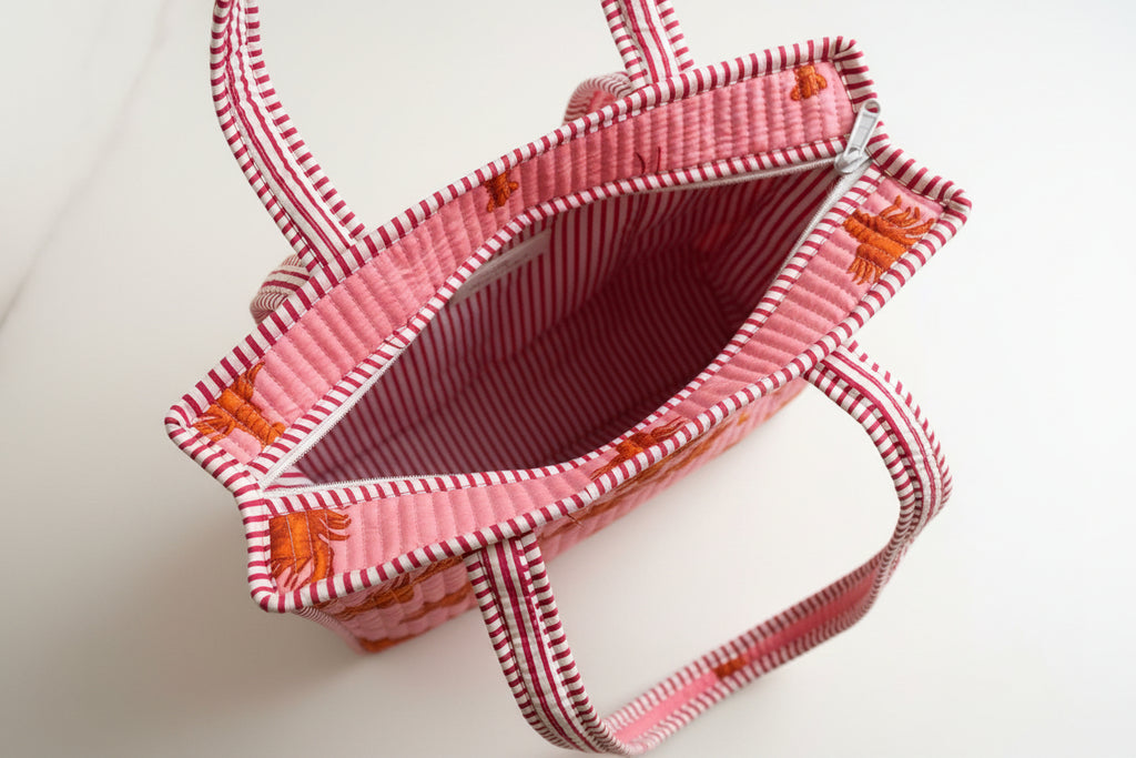 Midi draagtas roze 🦞