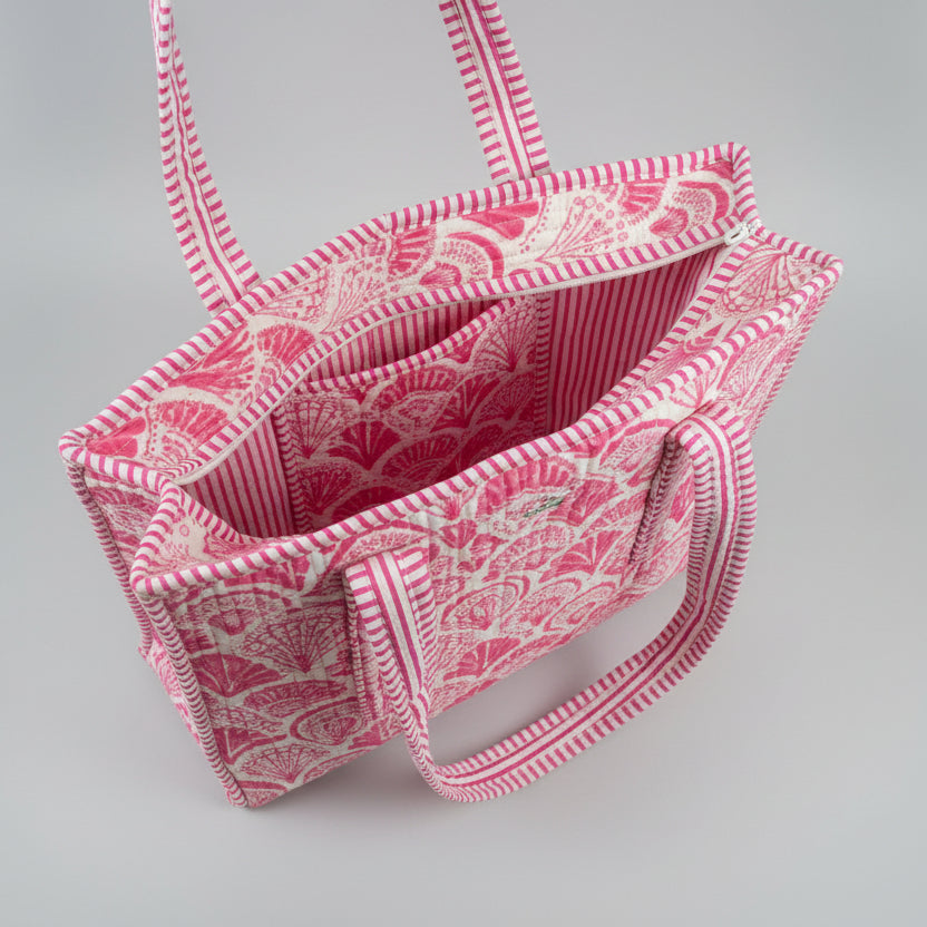 Midi draagtas roze 🐚