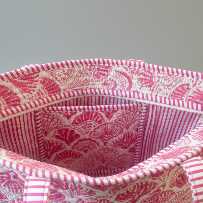 Midi draagtas roze 🐚